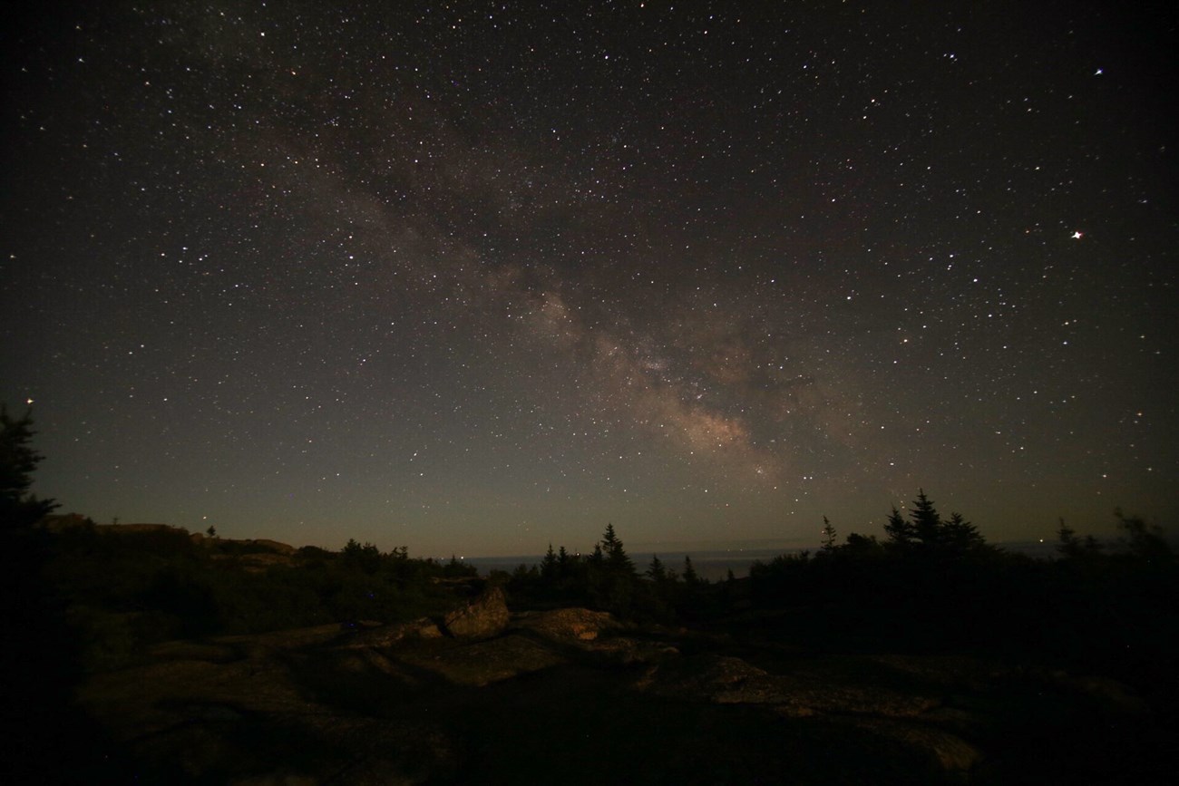 Night sky view with Milky Way on a mountain summit