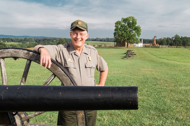 Ranger stands by cannon on the battlefield. Ranger stands by cannon on the battlefield.