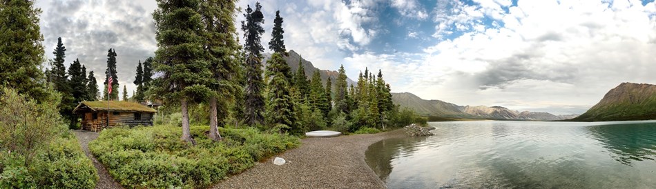 a panoramic shot of the Proenneke cabin with Upper Twin Lake a panoramic shot of the Proenneke cabin with Upper Twin Lake