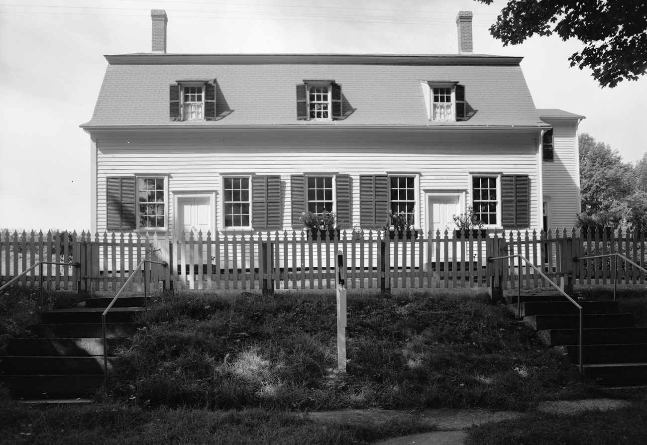 black and white photo of a white clapboard building