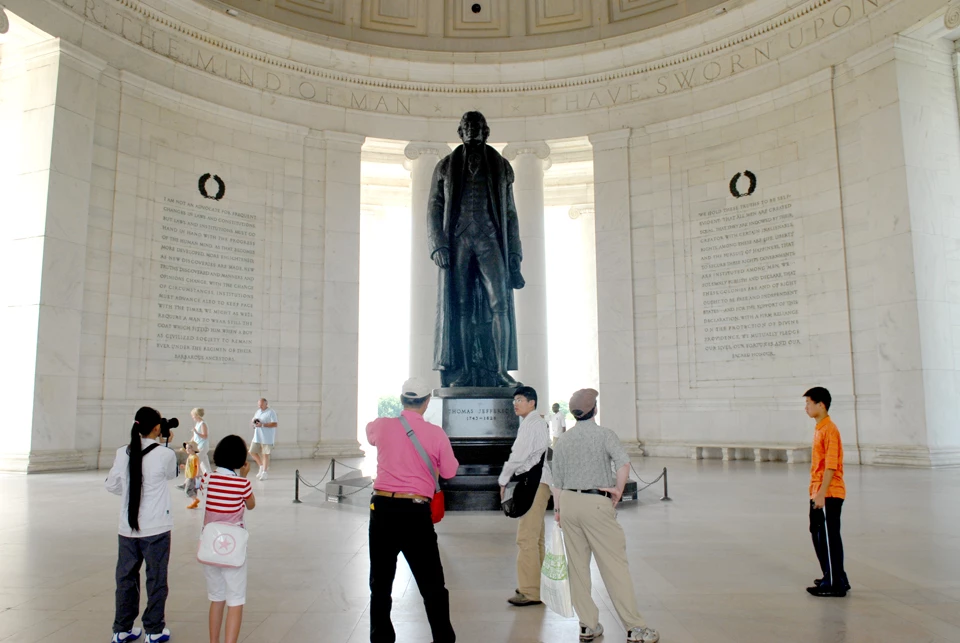 Thomas Jefferson Memorial Interior A group of adults and children take photos of a bronze statue of Thomas Jefferson