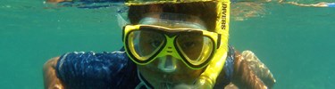 child snorkeling in clear Virgin Islands National Park waters