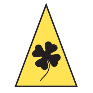 Clover Creek Route Marker A yellow triangle with a black four leaf clover inside of it.