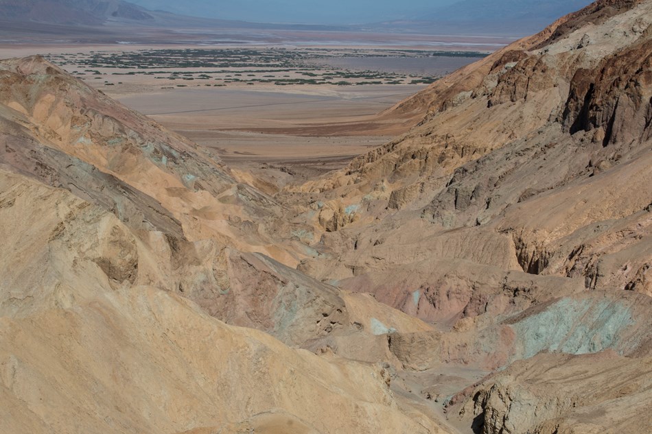 A multi-hued canyon viewed from above. A multi-hued canyon viewed from above.