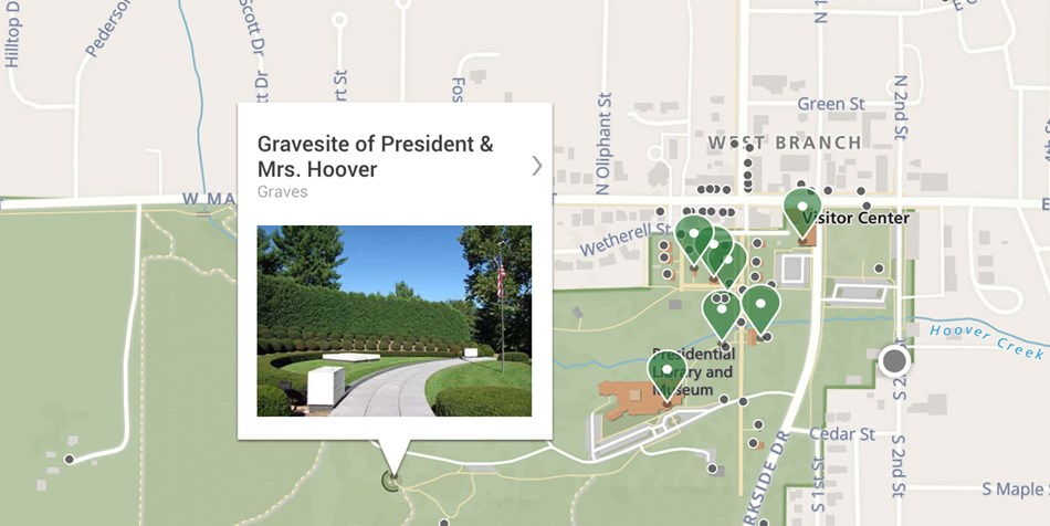 A screen from a mobile app shows a park map with a feature highlighted in a call-out box. A screen from a mobile app shows a park map with a feature highlighted in a call-out box.