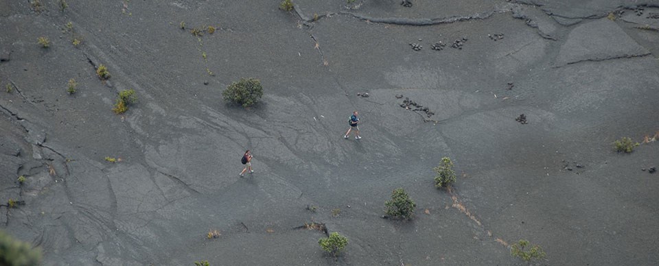 Hikers on the Kīlauea Iki Trail Hikers on the Kīlauea Iki Trail