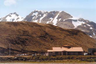 buildings in front of a mountain backdrop