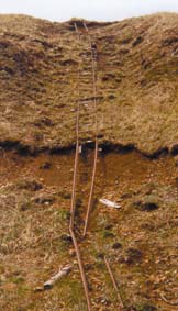 rails from tracks hang down a steep slope