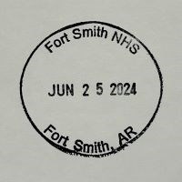 A circular ink stamp with the text, "Fort Smith NHS, JUN 25 2024, Fort Smith, AR."