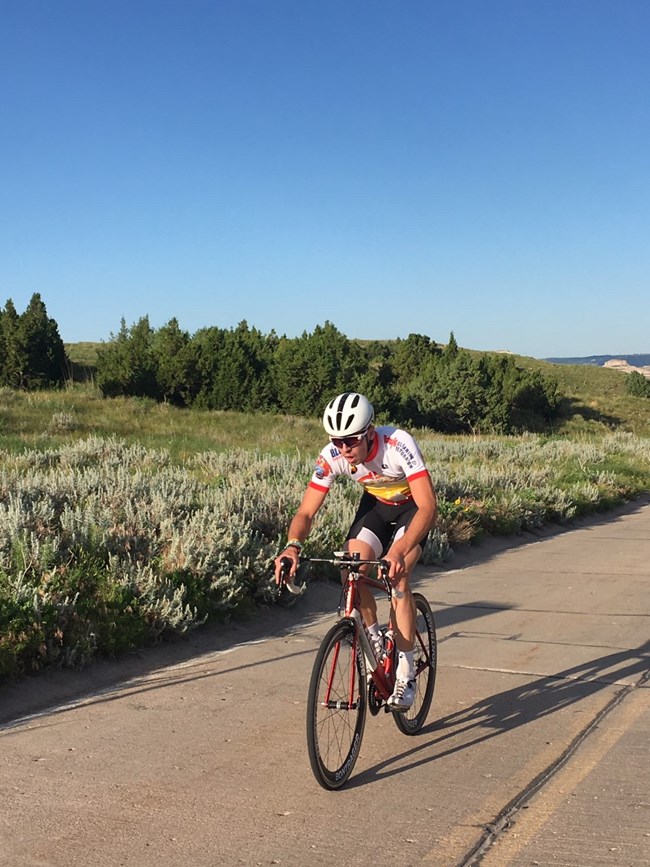 Bicycling the Closed Summit Road. A person rides a bicycle on a closed road.