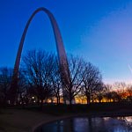 dark blue sunset sky behind jefferson arch in st. louis