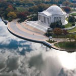 image of jefferson memorial. memorial on right, clouds reflected in water on left image of jefferson memorial. memorial on right, clouds reflected in water on left