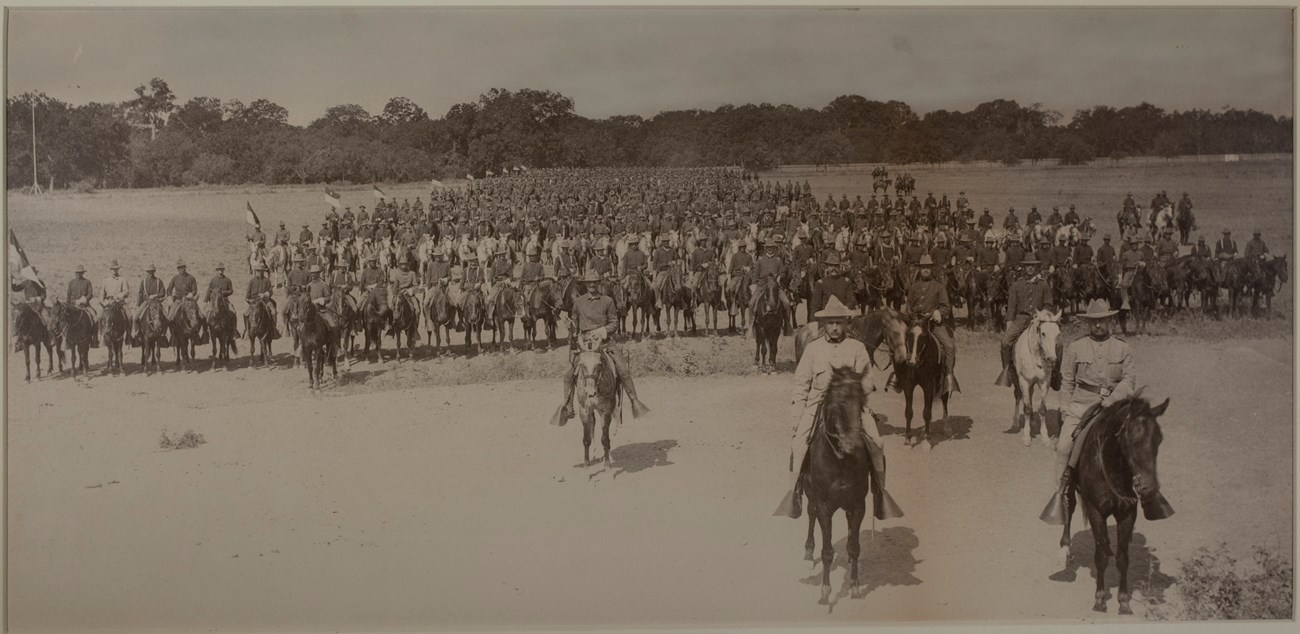 Photograph of rough riders on horseback