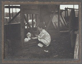 Quentin with two white rabbits.