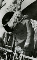 Roosevelt delivering a speech from the back of a train.