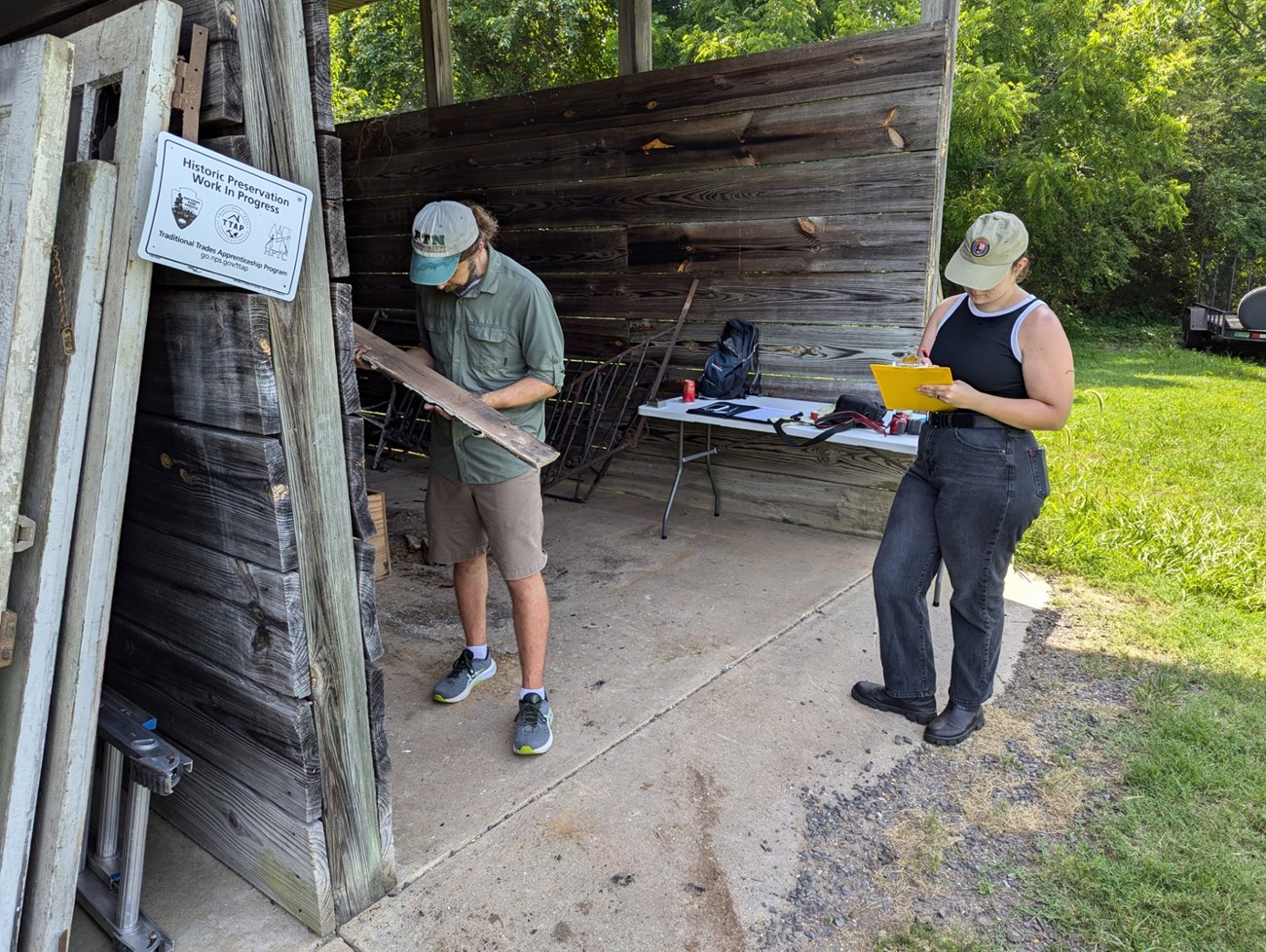University of Mary Washington staff and park volunteer conducting an assessment of architectural fragments.