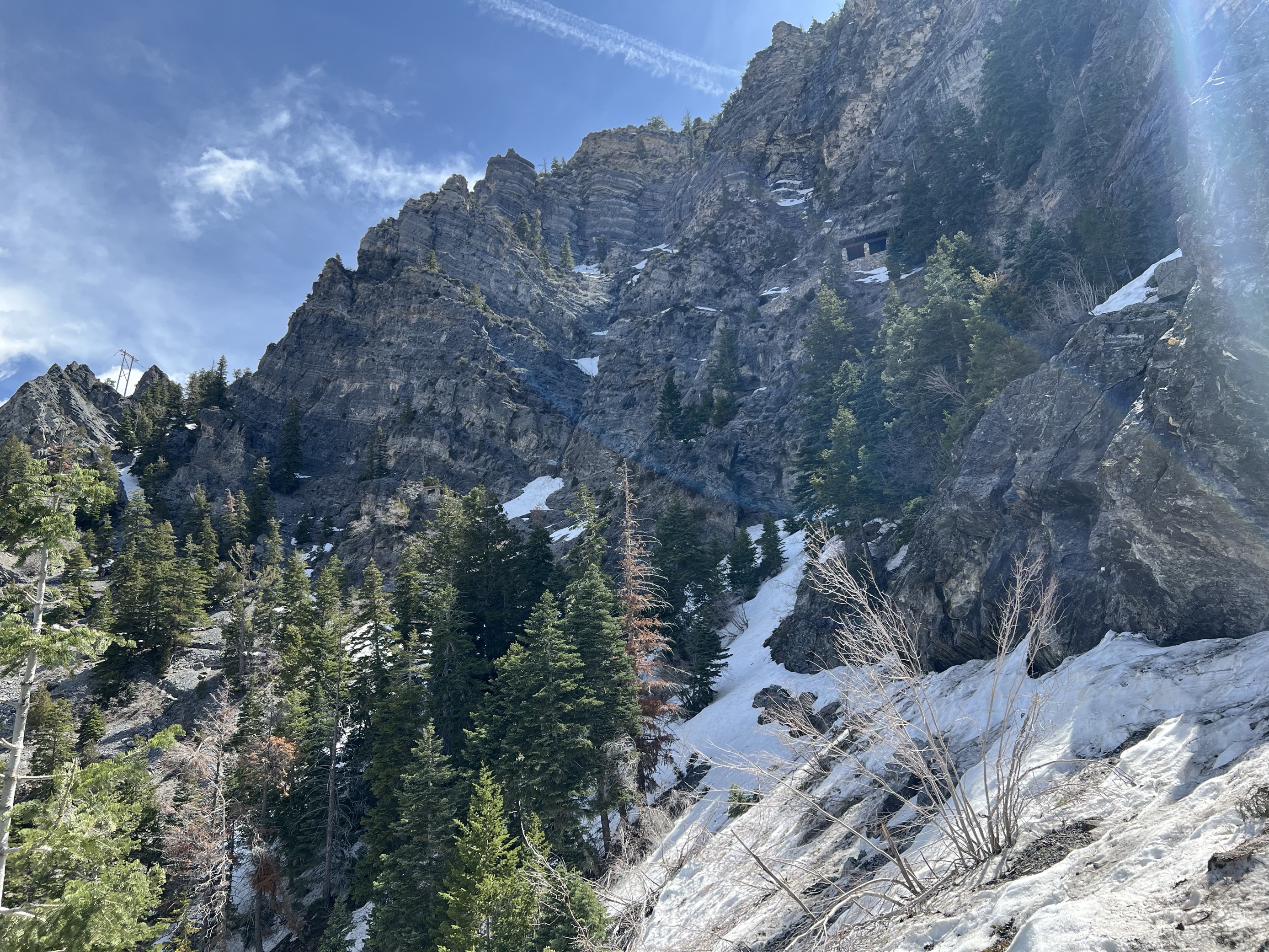MicrosoftTeams-image (16) Snow covering a mountainside with a small, stone building visible.
