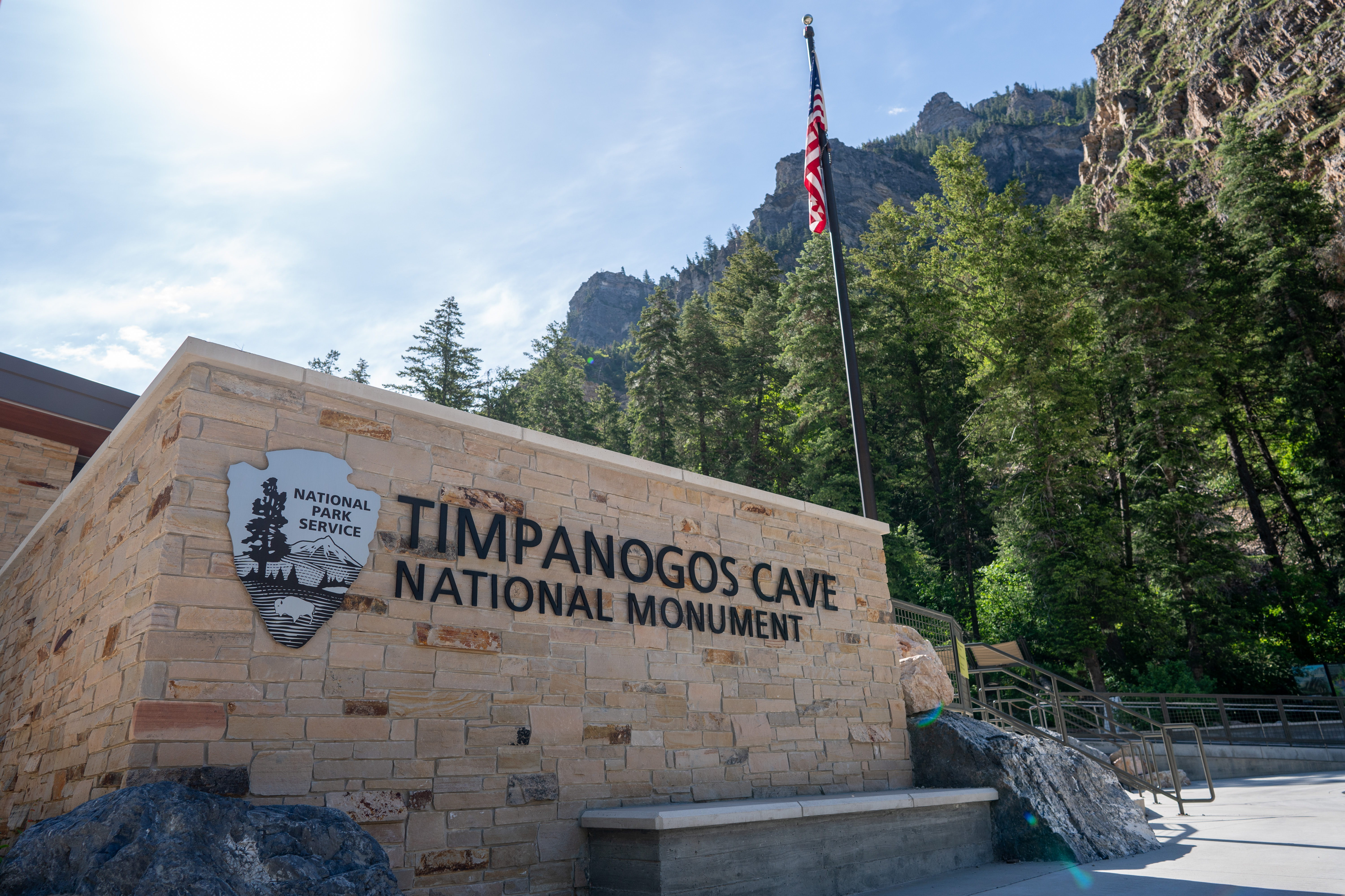 buildings-structures-2 A silver National Park Service arrowhead by the sign reading "Timpanogos Cave National Monument"