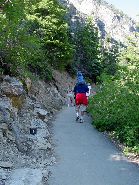 Family walking up the cave trail