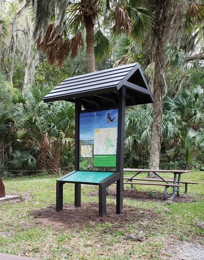 a map upright panel with a rook and a tactile map angled below