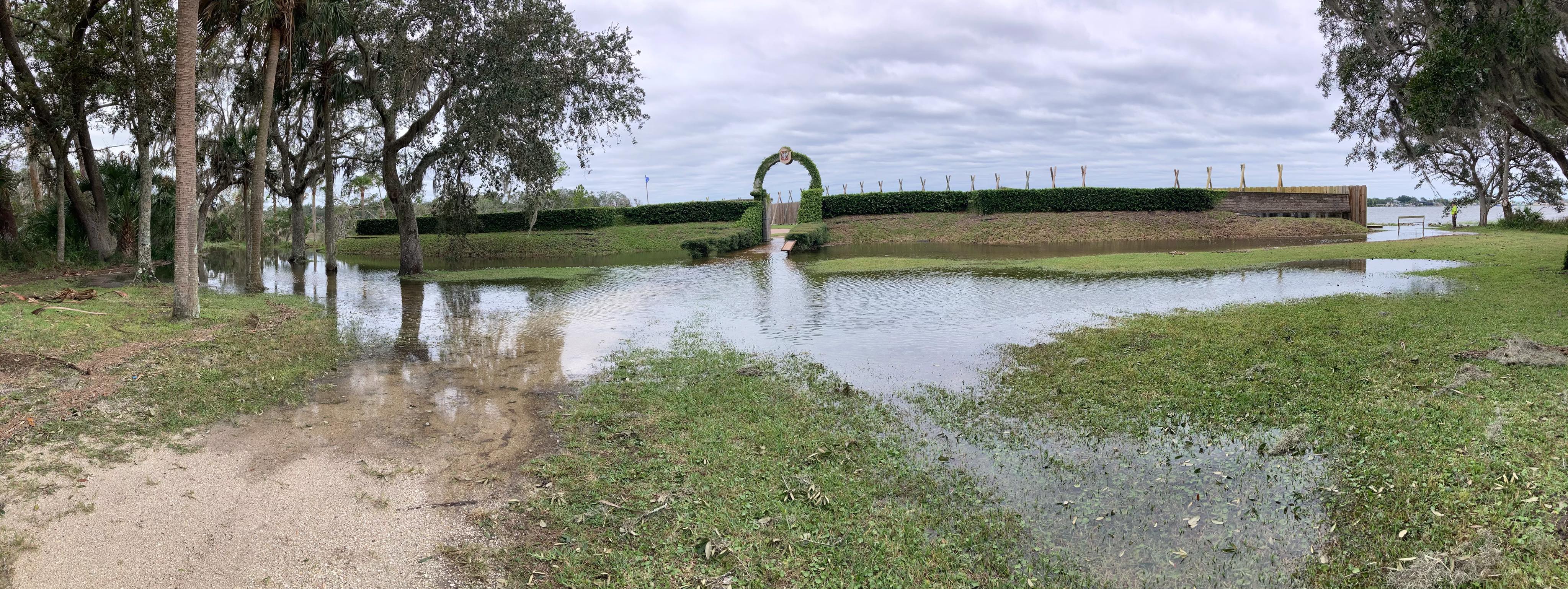 Hurricane Ian high Waters water flooding the moat and lawn of Fort Caroline