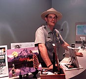 Park ranger at the visitor center desk. Park ranger at the visitor center desk.