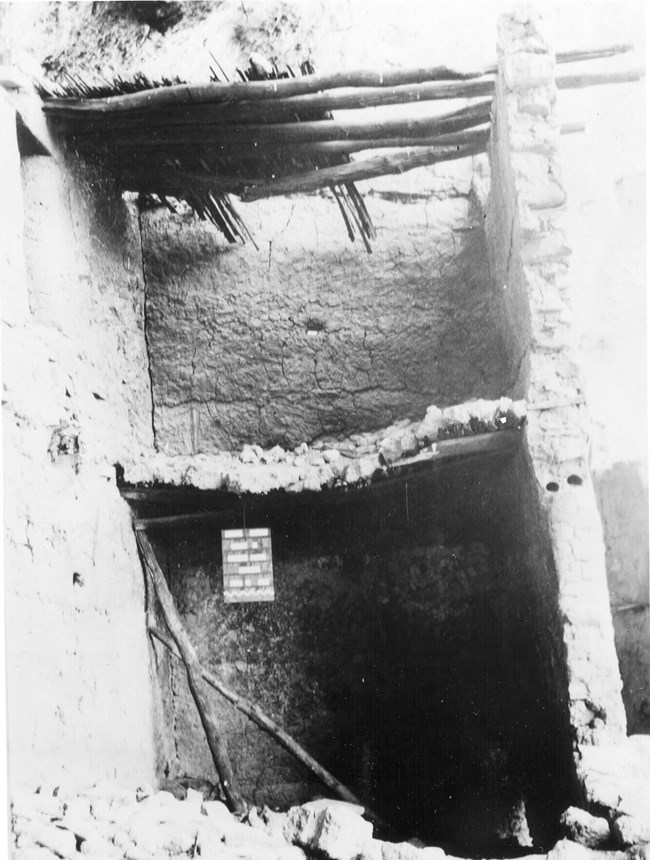 A black and white image of a two story room at the Upper Cliff Dwelling.