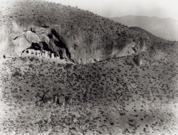 Image Depicting Adobe Structure in Side of Cliff