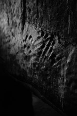 Black and White photo of handprints in the wall of the Lower Cliff dwelling