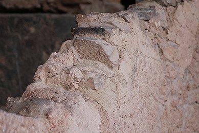 Top of wall made with rocks and clay.