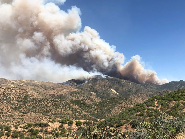 Hills with smoke from fire