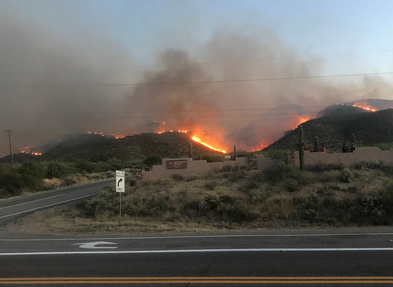 Entrance of Tonto NM with hills on fire