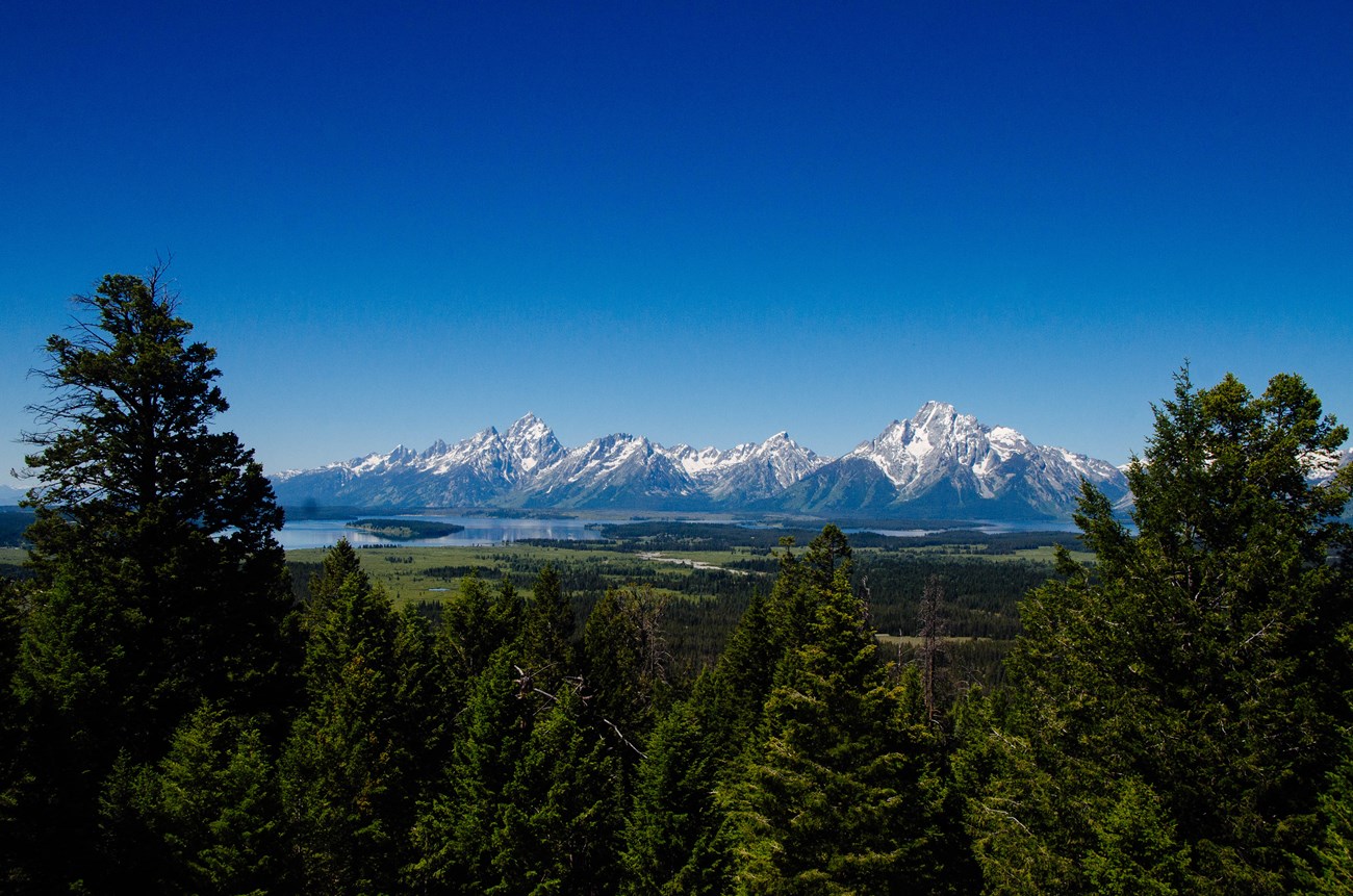 Grand View Point TH A mountain range and a lake as viewed from a high vantage point.
