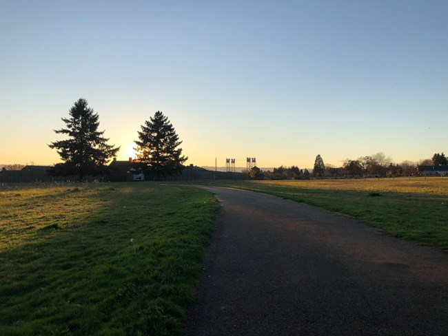 Sunset over a paved trail that leads to Fort Vancouver.