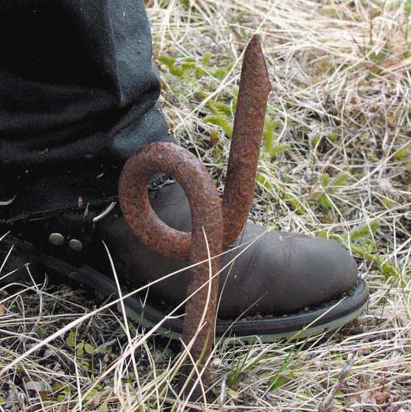 a twisted bar of metal in grass