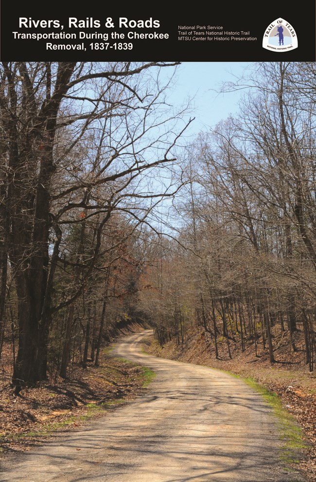 lt= The cover of a booklet, with a road through the forest.