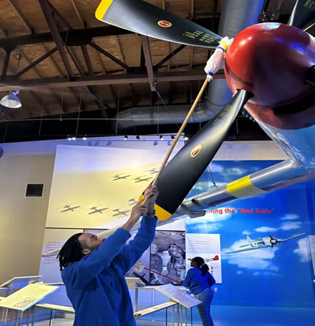 SCA Intern Cleaning Aircraft