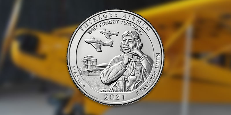 2021 Tuskegee quarter on a blurred background of a piper cub airplane