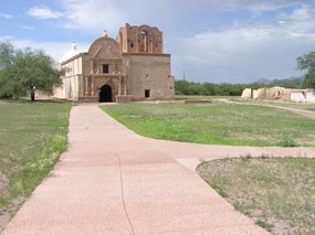 walkway leading to church with mountains in background