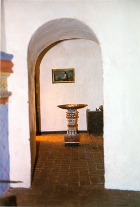 detail of diorama showing baptismal font