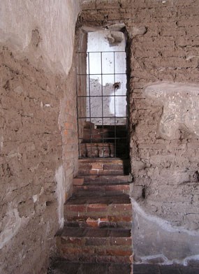 steps leading to gated doorway