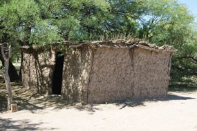 mud house with thatch roof