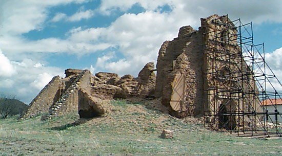 ruins of mission with scaffolding over façade