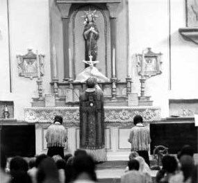 Franciscan priest saying mass