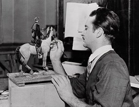 Lorenzo Moffet historic photo of man painting horse model