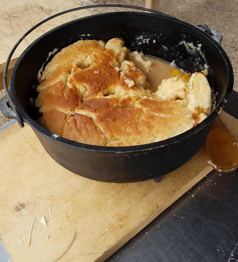 2018-easter-sweets-cooking-peach-cobbler peach cobbler in dutch oven