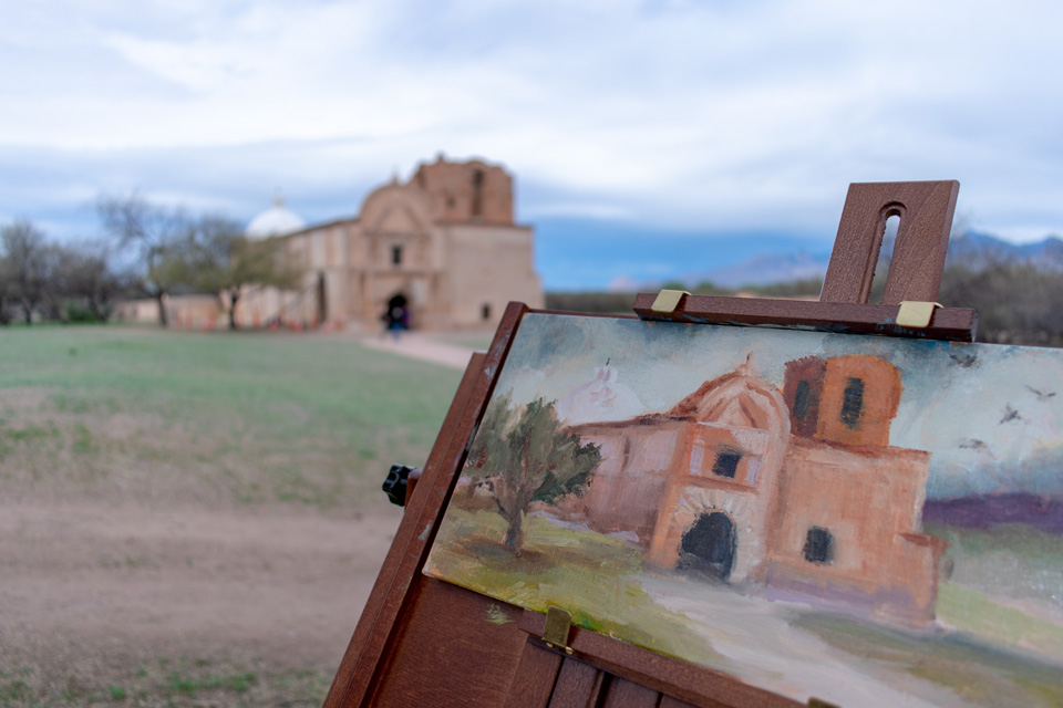 Everyone loves the view of the church from the southwest side. What new artistic subjects do you find interesting here at Tumacácori? oil painting on easel in front of church
