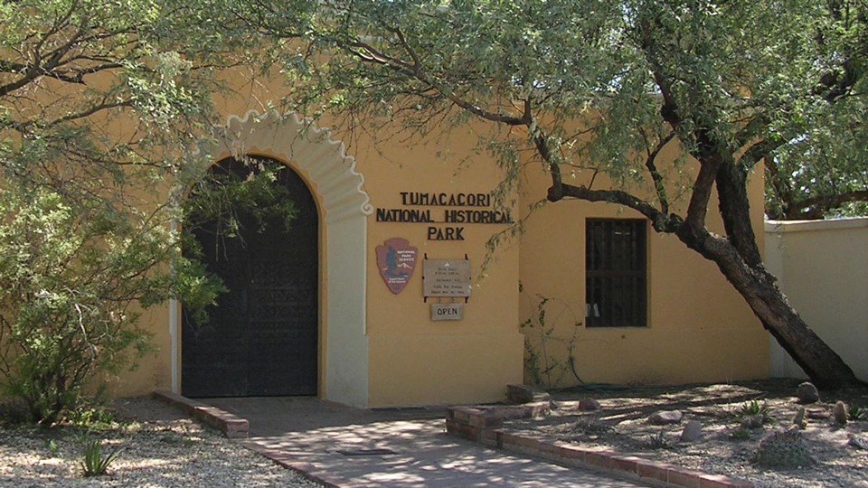 front of visitor center with scallop motif over arched doorway