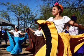 smiling young dancer with mexican yellow skirt smiling young dancer with mexican yellow skirt