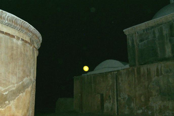 Full Moon in sky over sacristy dome with mortuary chapel in foreground Full Moon in sky over sacristy dome with mortuary chapel in foreground